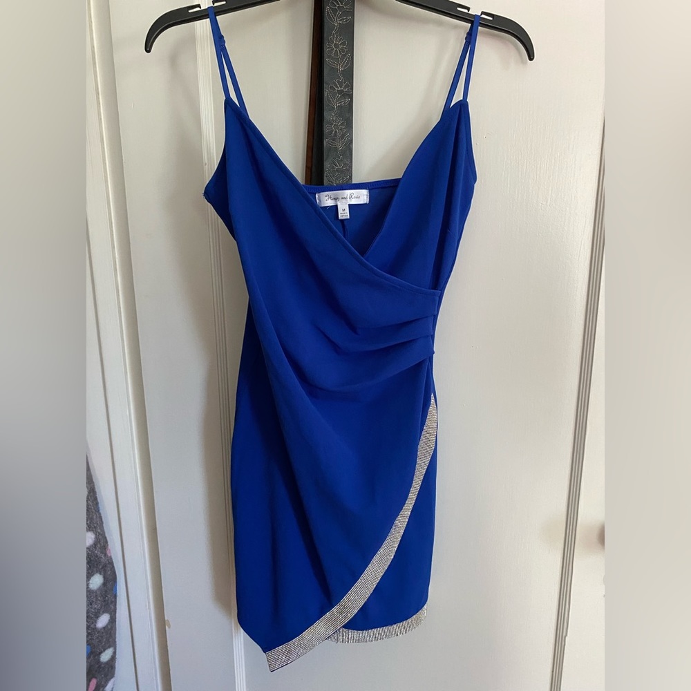 Short, blue, asymmetrical, bedazzled, formal dress. It’s super cute, & fits well
